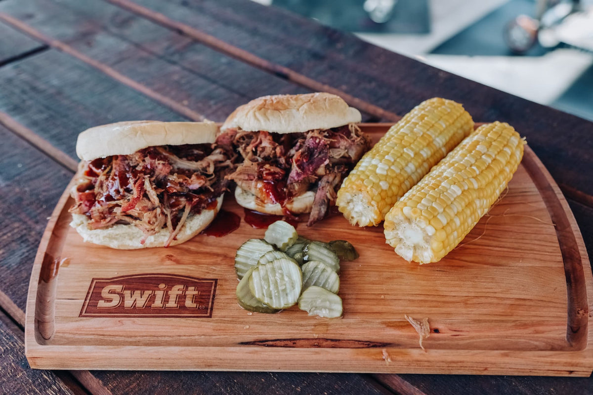 Pulled pork sandwiches seasoned with Chicken & Pork Rub, with corn and pickles