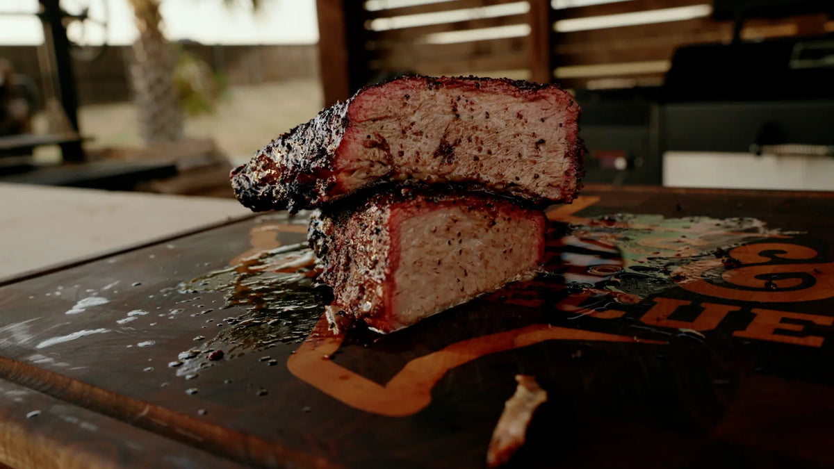 Smoked Trisket slices showing bark and smoke ring